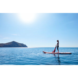 A Woman Riding The Redshark Multi Water Sports Board Inflatable SUP
