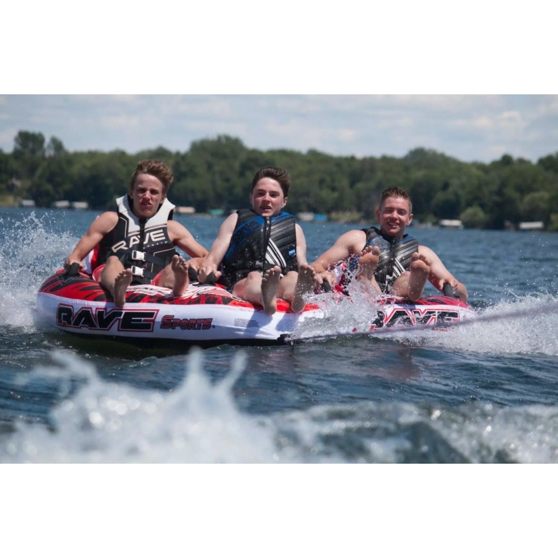 Front view of 3 mean riding in Rave Sports Warrior III - 3 Rider Towable 02379