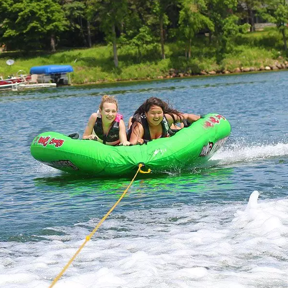 2 woman riding Rave Sports Mambo 3 Rider Towable 02463