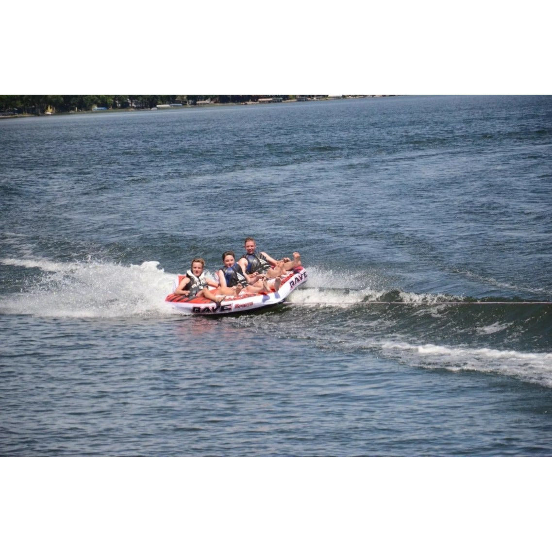 3 people enjoying Rave Sports Warrior III - 3 Rider Towable 02379