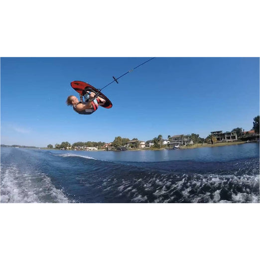 Kneeboard - Man riding on HO Sports Neutron Kneeboard with Powerlock Strap
