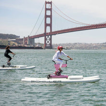 Load image into Gallery viewer, Women riding the Schiller S1- C water bike with the Schiller Bikes S1-C Front Deck attached