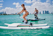 Load image into Gallery viewer, Man and Woman riding the Schiller S1- C water bike with the Schiller Bikes S1-C Front Deck attached 