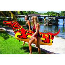 Load image into Gallery viewer, WOW Weiner Dog 3 Towable Tube being towed with 2 female carying it