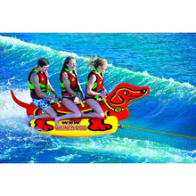 Load image into Gallery viewer, WOW Weiner Dog 3 Towable Tube being towed with 3 people riding on it