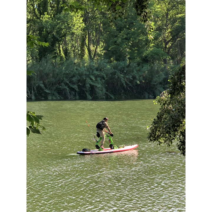 A Man Riding The Red Shark Bike Surf Adventure Water Bike