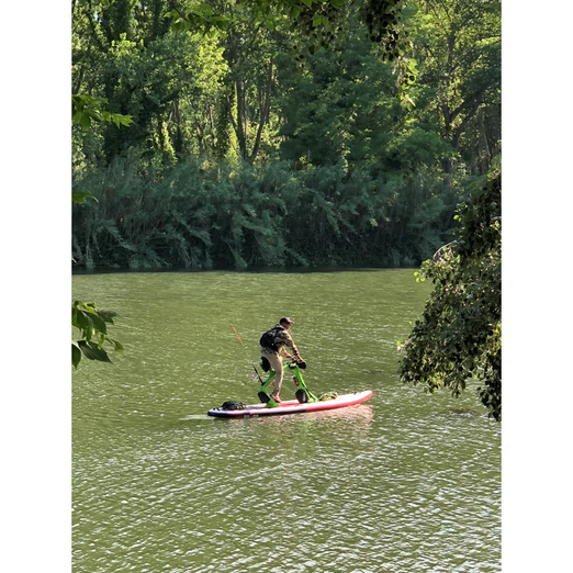A Man Riding The Red Shark Bike Surf Adventure Water Bike