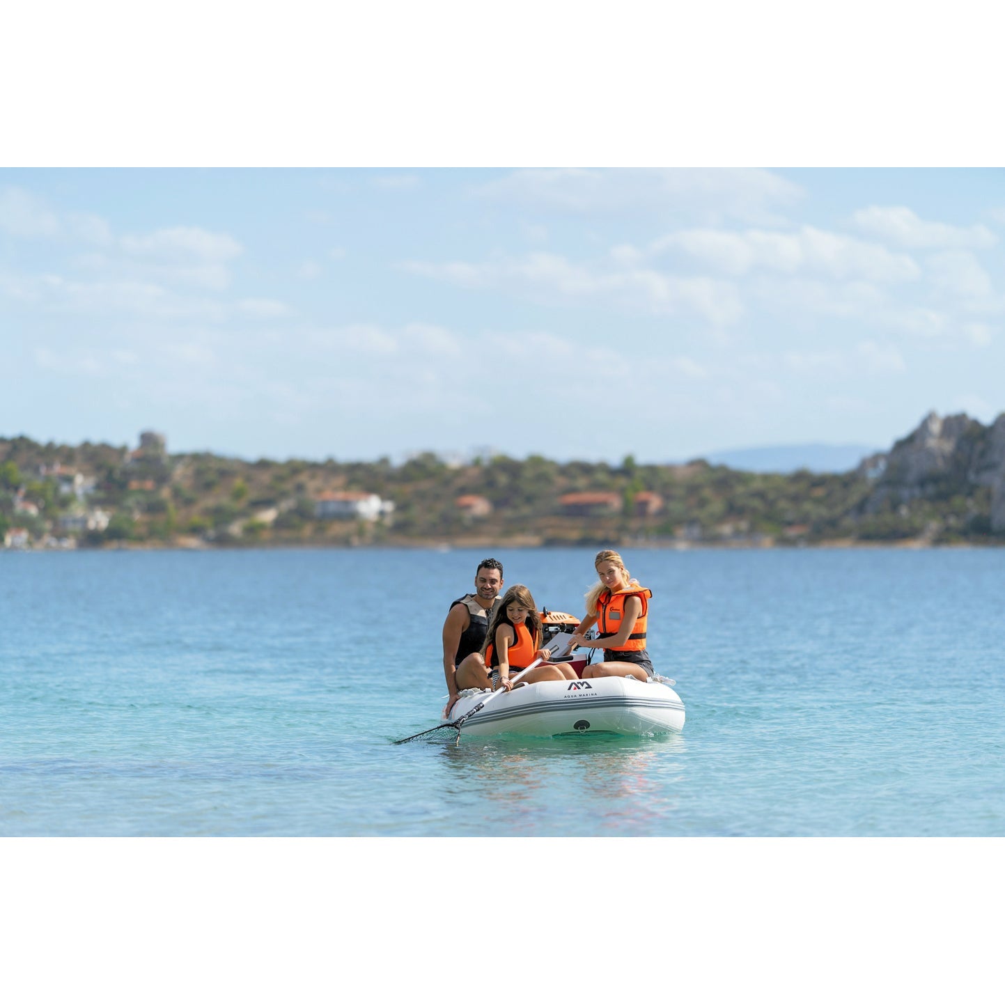 Inflatable boat - man and woman with child boarding the  Aqua Marina Deluxe U-Type Yacht Tender 11’6″ (350cm) with DWF Air Deck BT-UD350