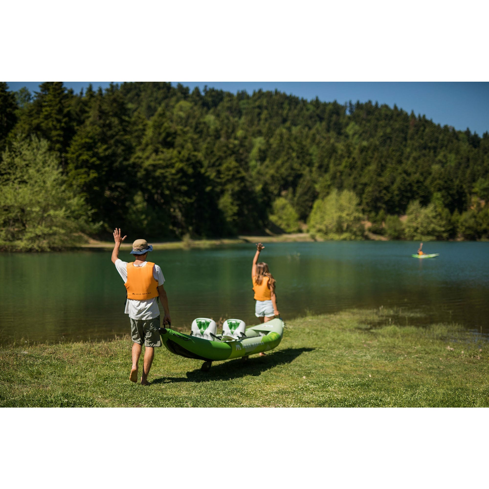 Inflatable Kayak -Man and Woman carrying the New 2022 Aqua Marina Betta 13'6" (412cm) Recreational Inflatable 2 Person Kayak BE-412-22