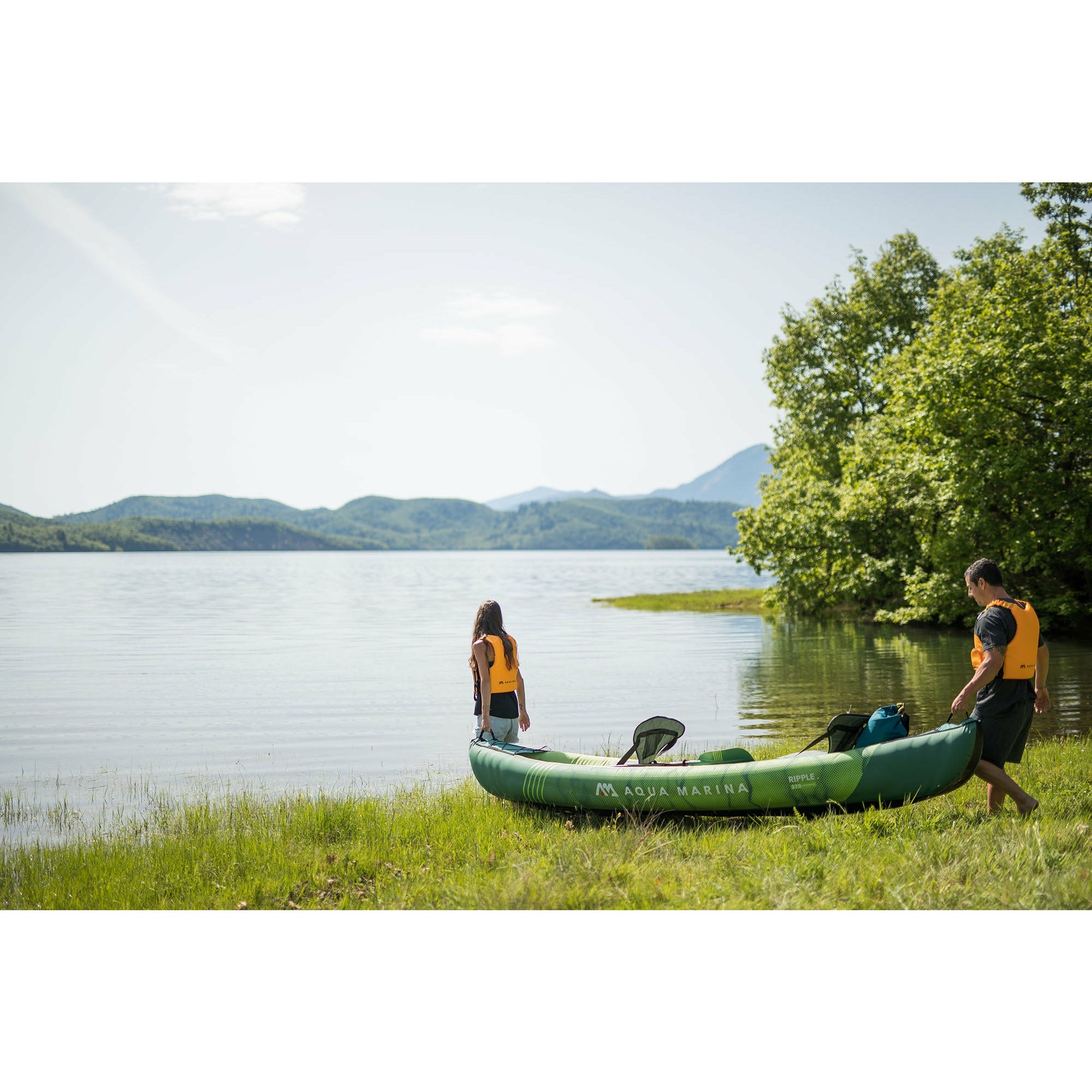 Inflatable Kayak - Man and Woman carrying the Aqua Marina Ripple 12'2" Recreational Inflatable Kayak RI-370 3-Person 2022