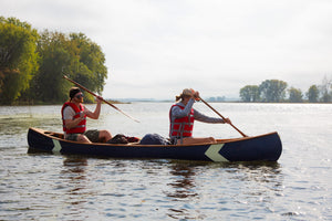 Man and woman paddling with the Merrimack Canoes Tennessean 14'6" Canoe