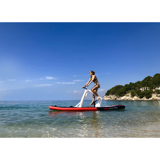 A Woman With Red Shark Bike Surf Enjoy Water Bike