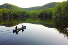 Load image into Gallery viewer, Man and woman travelling with the Merrimack Canoes Sanborn + Merrimack Driftless Canoe