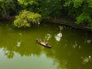 two people riding the Merrimack Canoes Traveler - 17" Canoe