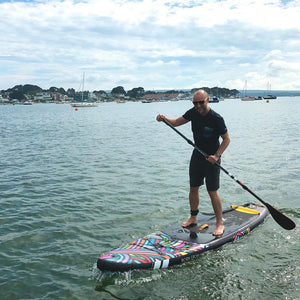 Inflatable Stand Up Paddleboard - Man paddling with the Hurley PhantomTour 10'6" iSUP Color-Wave HUR-002 