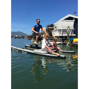 a family having fun riding the Schiller S1-C water bike with  Schiller Bikes S1-C Front Deck attached
