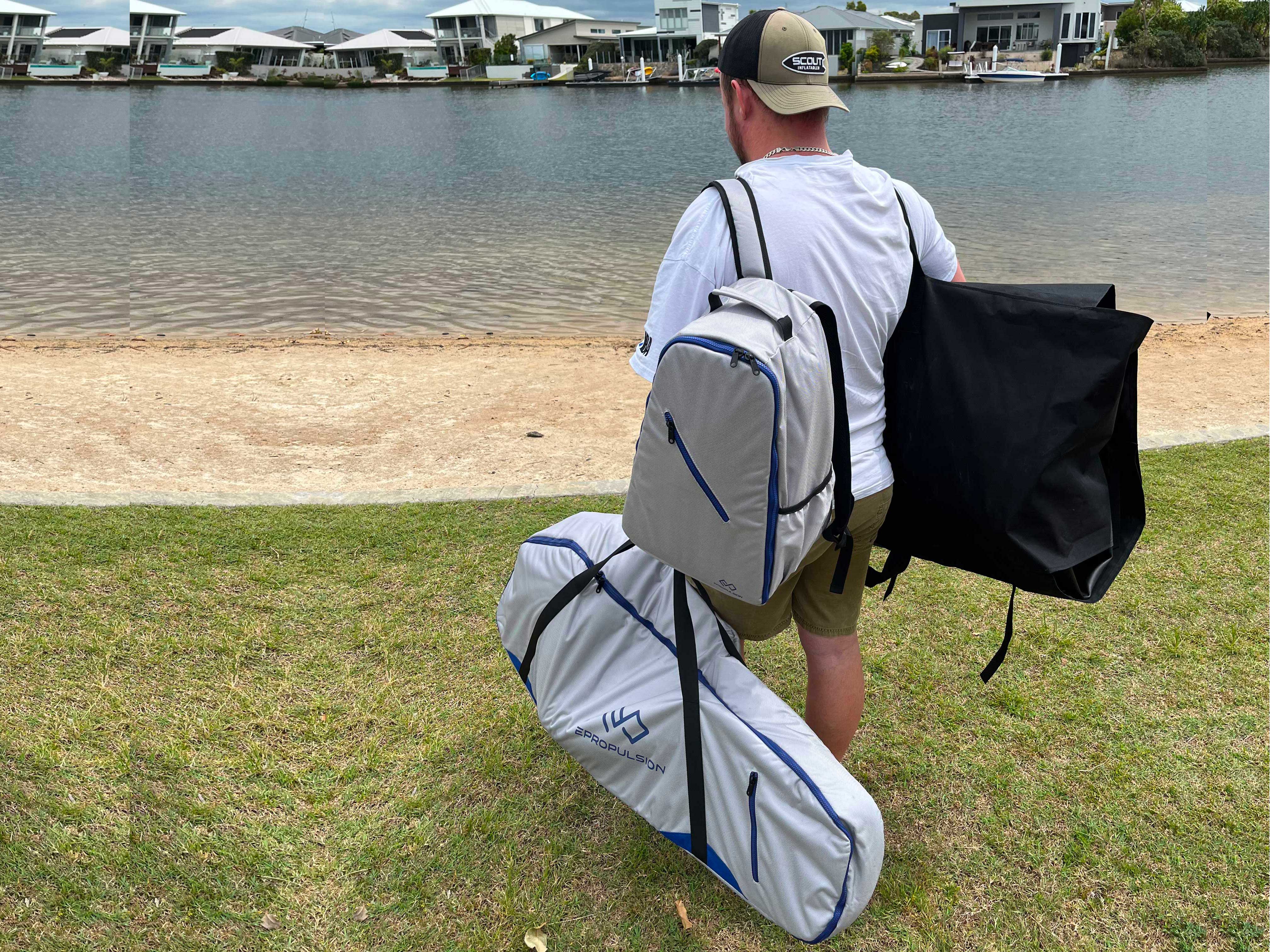 Man carrying the Scout Inflatables 245 Scout in a bag