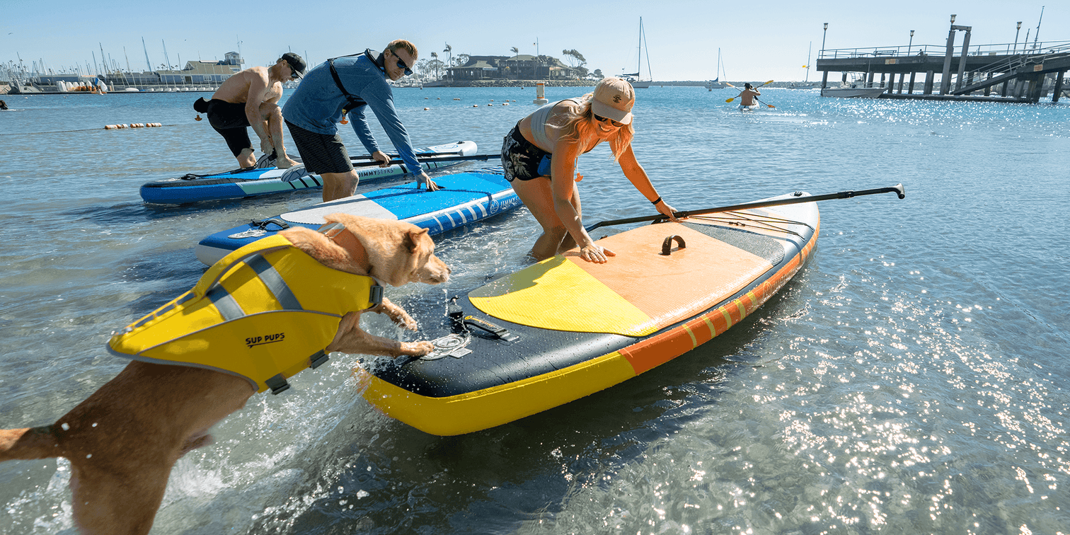 Women And Her Dog Mounting A JimmyStyks Mutt 10'4" ISUP