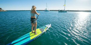 Women Paddling A Jimmy Styks Neptune 12'6" Inflatable Sup