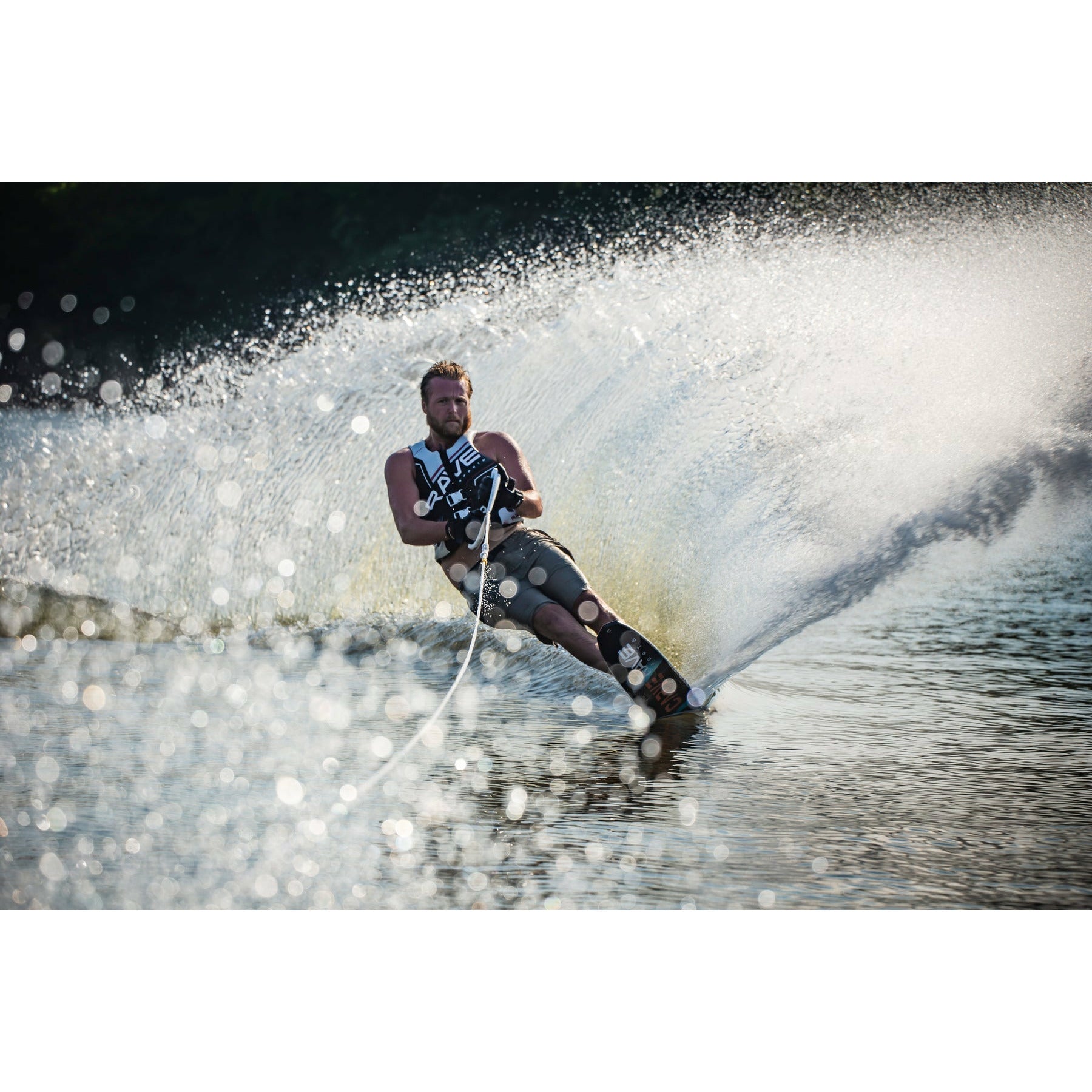 A man skiing using Rave Carve Slalom Water Ski