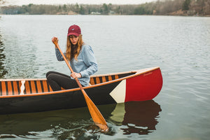 Woman paddling with the Merrimack Canoes Sanborn + Merrimack Pickwick Canoe