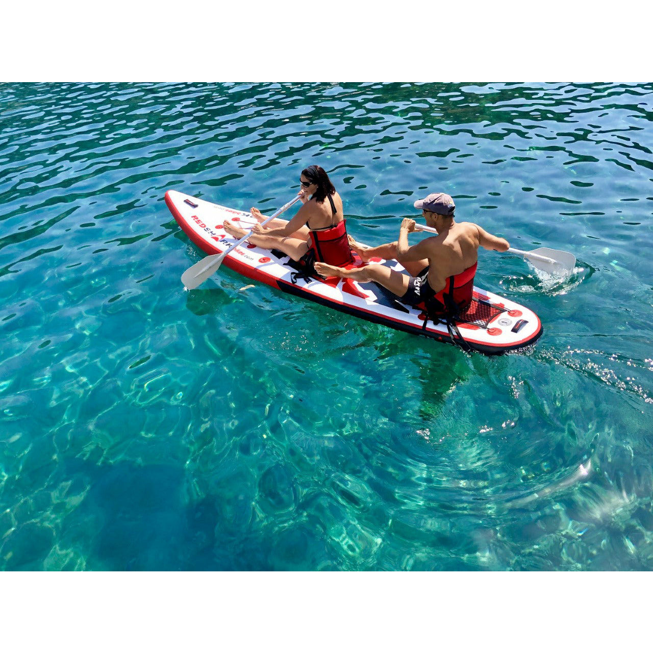 2 People Riding The Red Shark Multi Water Sports Board Inflatable SUP  with Kayak Kit