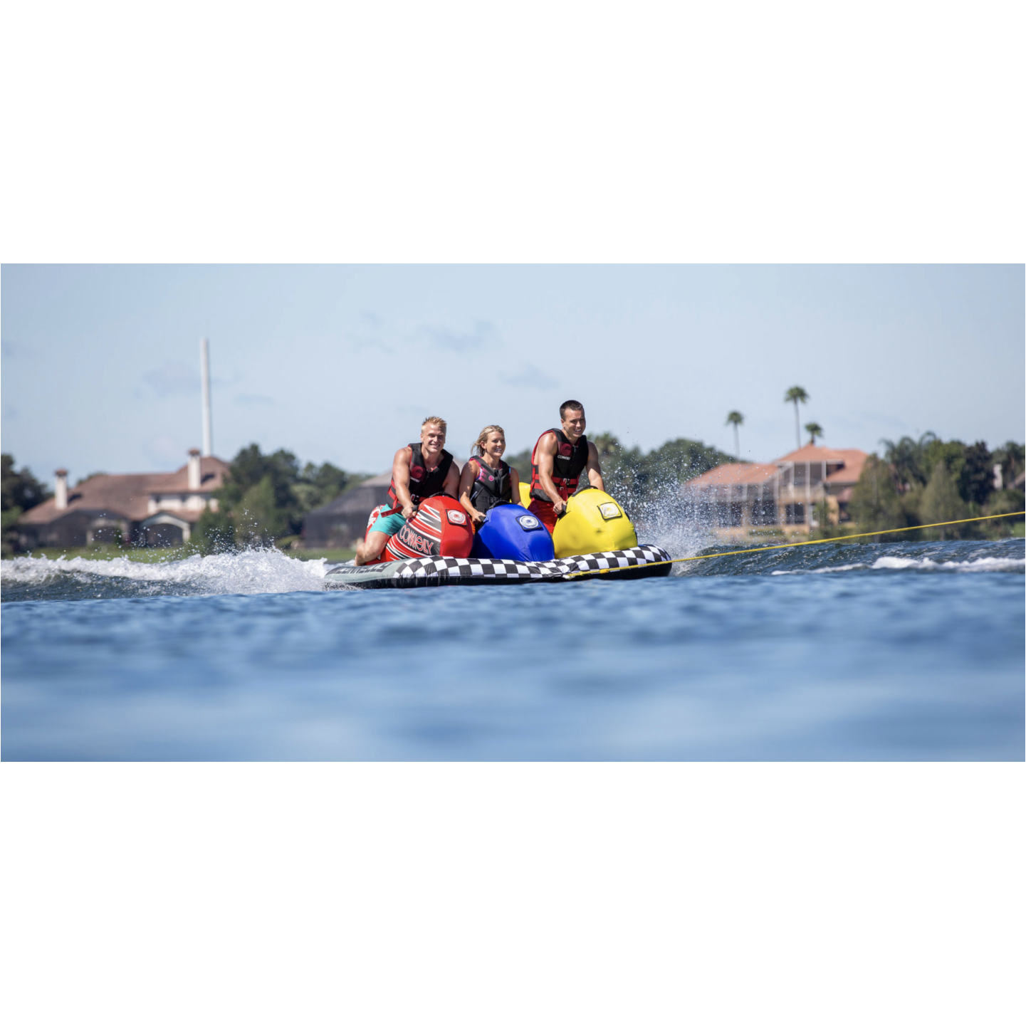 Towable/Tubes - Men and Woman riding a Connelly Ninja 3 Saddle Seat Tube