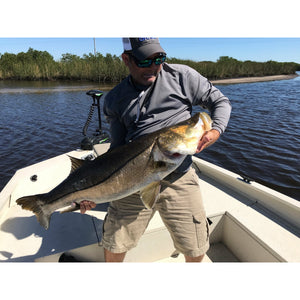 Trolling Motor - Man holding a fish with Rhodan Marine HD GPS Anchor ® Trolling Motor – 24V Black on his boat