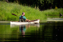 Load image into Gallery viewer, Man paddling with the Merrimack Canoes Solitaire 11&#39;9&quot; Solo Canoe at the lake.