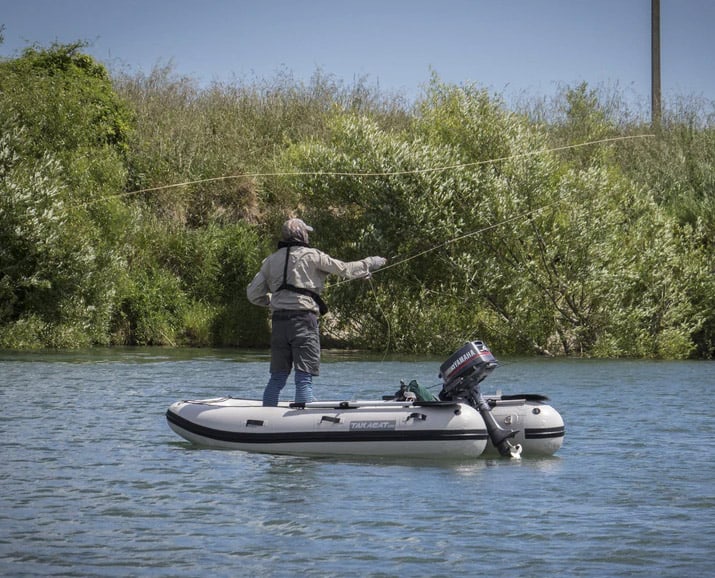 Man fishing with the Takacat T380S Inflatable Boat