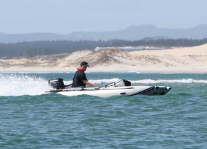 Man on board the Takacat T380LX Inflatable Boat