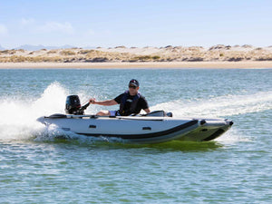 Man riding the Takacat T380LX Inflatable Boat