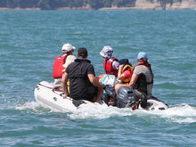 Load image into Gallery viewer, Family on board  the Takacat T380LX Inflatable Boat
