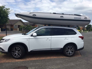 Takacat T420LX Inflatable Boat ready for transport on top of a car