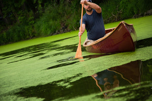 Man riding solo on a Merrimack Canoes Tennessean 14'6" Canoe