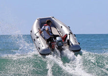 Load image into Gallery viewer, Man driving the Takacat T260S Inflatable Boat