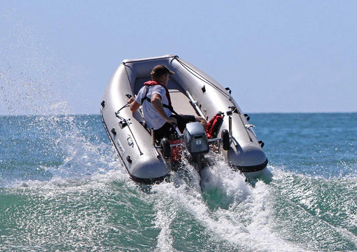 Man riding the Takacat T300S Inflatable Boat 