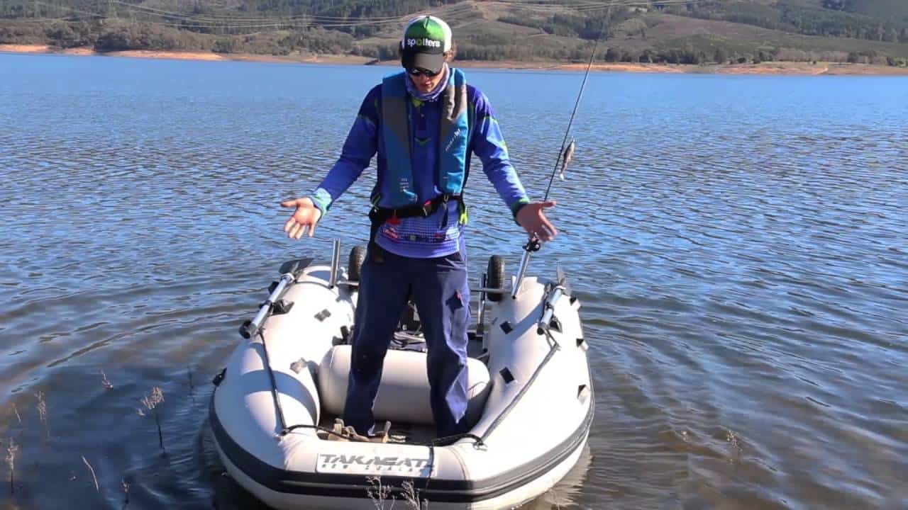 Man fishing with the Takacat T380S Inflatable Boat