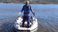 Man standing on the Takacat T260S Inflatable Boat