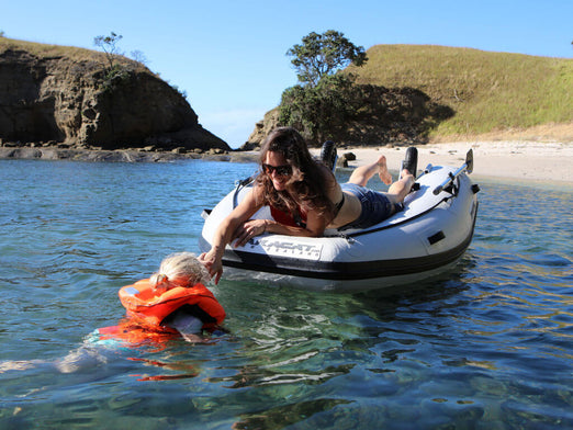 Takacat T260S Inflatable Boat with mother on board helping daughter to board