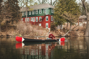 Man riding solo on a Merrimack Canoes Traveler - 17" Canoe