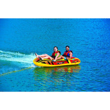 Load image into Gallery viewer, WOW Jet Boat 2P Towable Tube being towed with 2 people riding on it