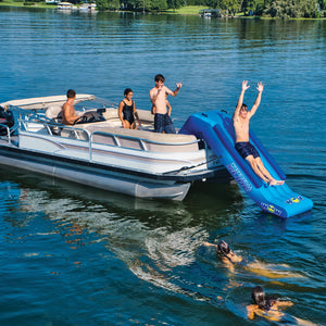 WOW Pontoon Waterfall Slide Inflatable Platform with a man slidding on it and 4 standing beside it