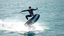 Load image into Gallery viewer, A man surfing using the WaveShark Electric JetBoard