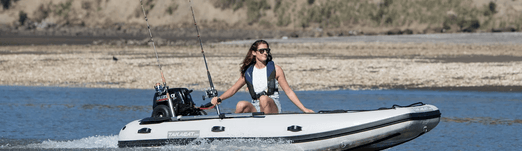 Woman riding the Takacat T300S Inflatable Boat