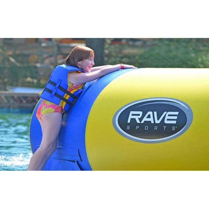 A kid hanging beside of Rave Sports Aqua Jump 120 Water Trampoline 00120