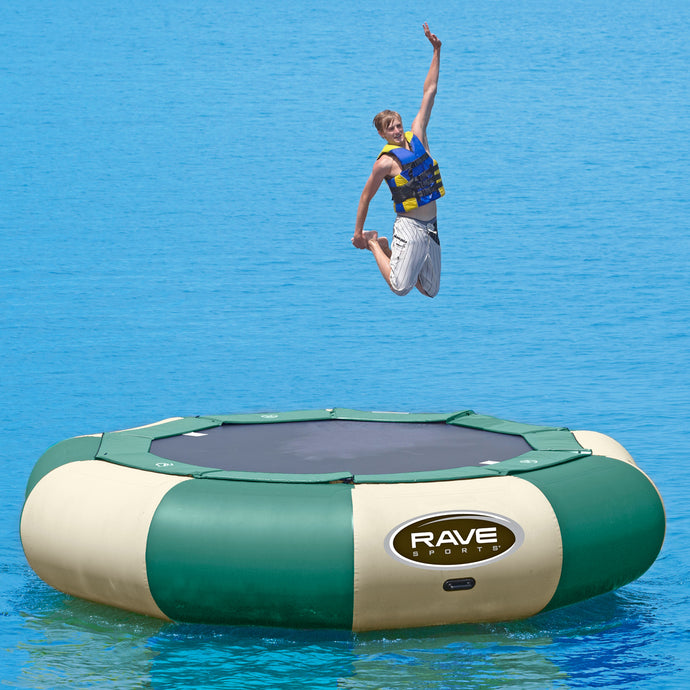 A man jumping in Rave Sports Aqua Jump 150 Northwoods Water Trampoline 00151