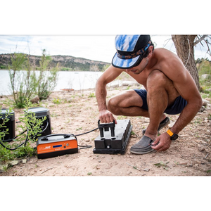 Man holding Yujet Surfer Electric Jetboard EJB-01 battery charger