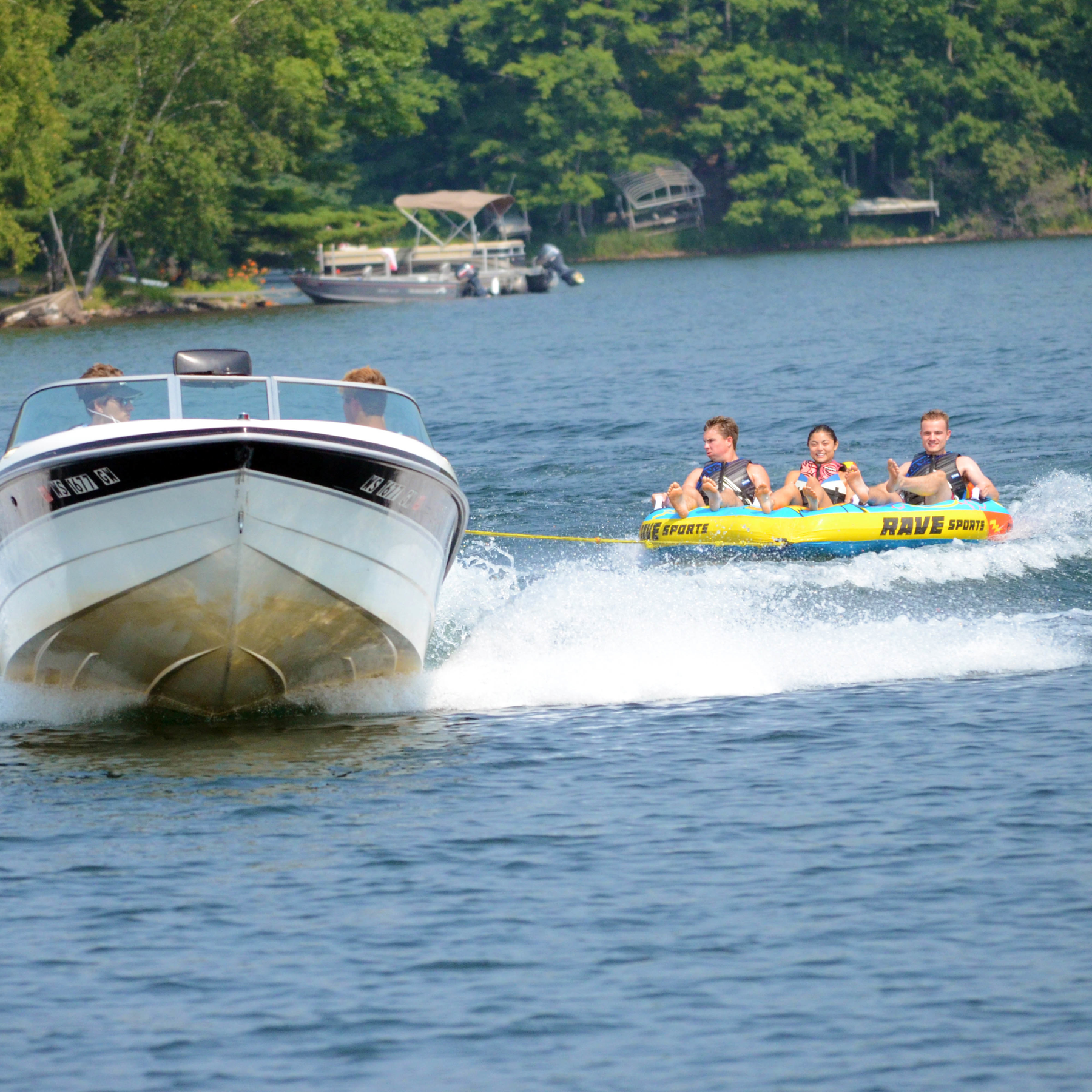 Rave Charger 3P Towable Tube being towed with 3 people riding on it