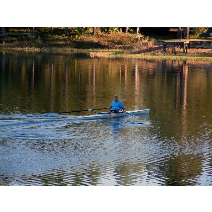 Boats - Man riding on Little River Marine Cambridge Rowing Shell in calm water